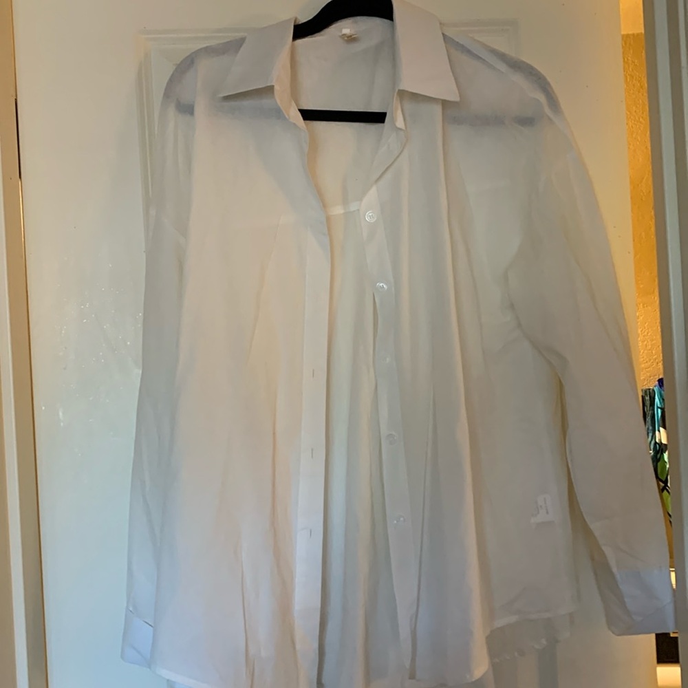 Cream, button-down collared shirt with French cuffs.